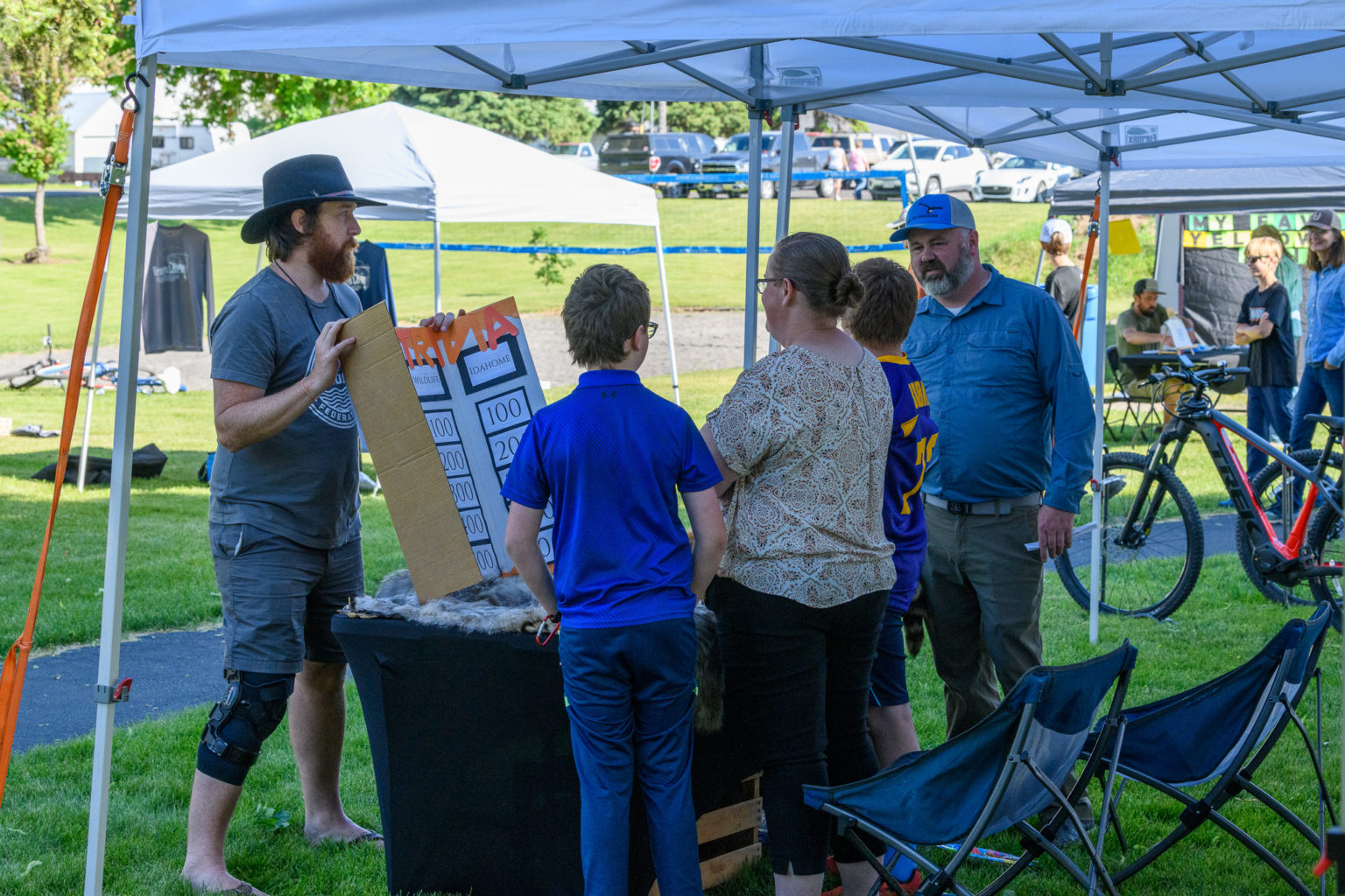 Man presenting at a booth at the Wildlife Festival